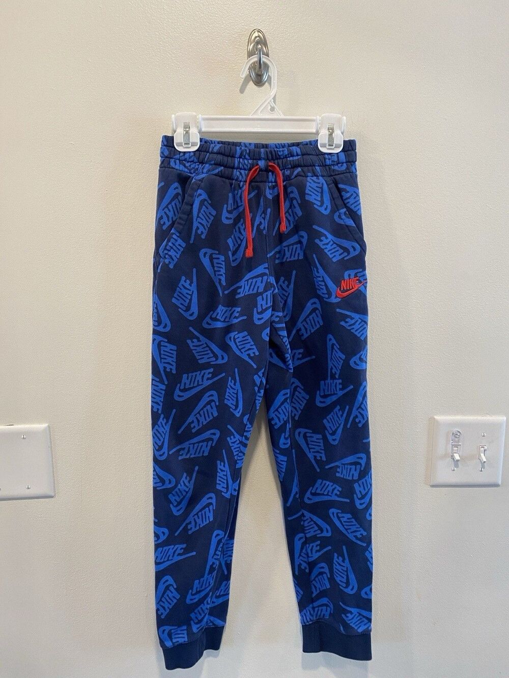 Nike Boys Sportswear Joggers Medium All over Nike Logo print Navy Blue Red